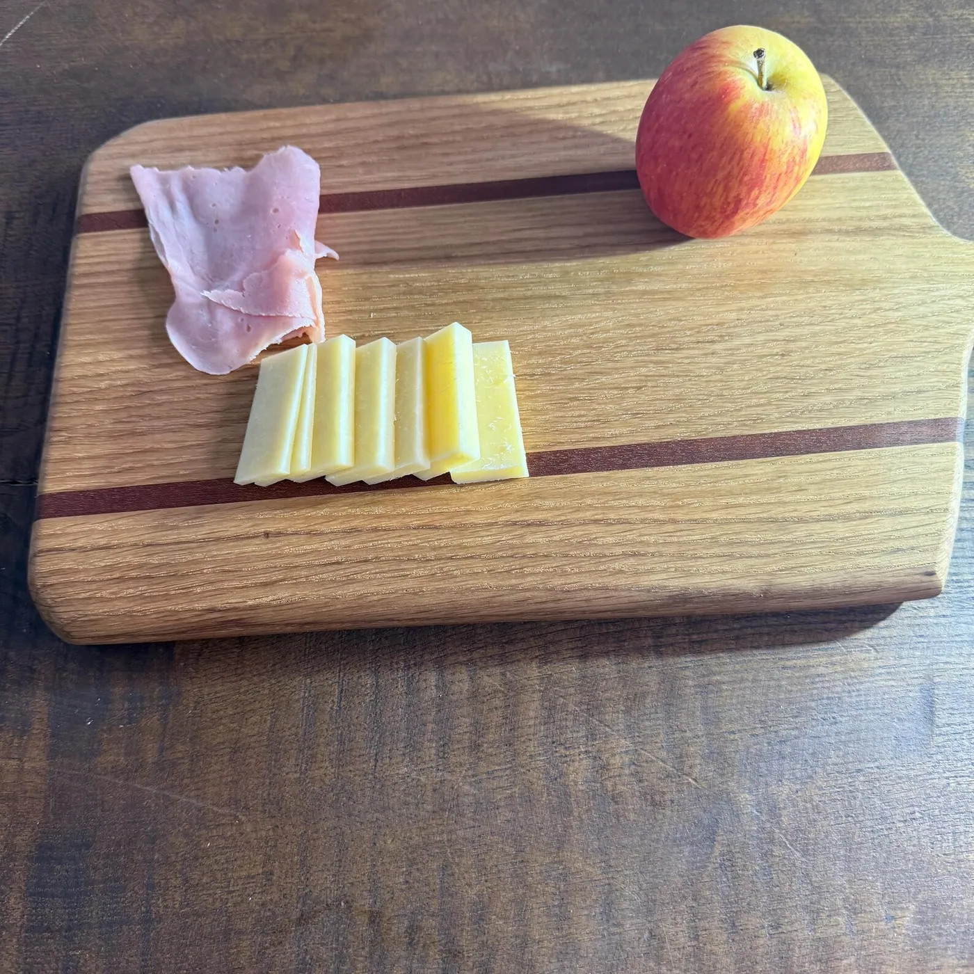 Oiled wooden serving board showing rich grain